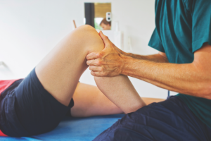 Therapist testing a patient's knee