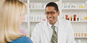 Pharmacist smiling at patient